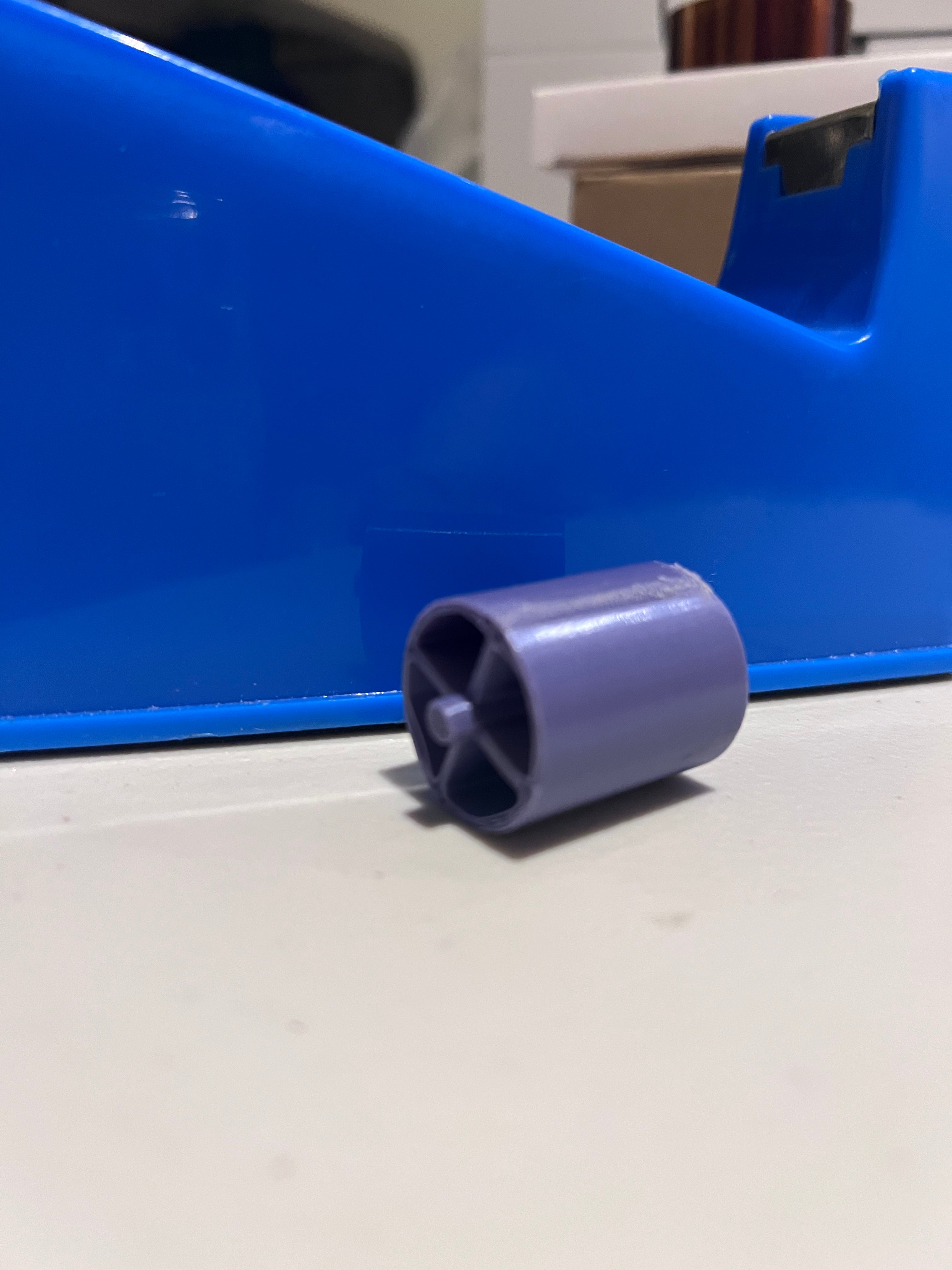 3D printed replacement roller for HTVRONT tape dispenser.